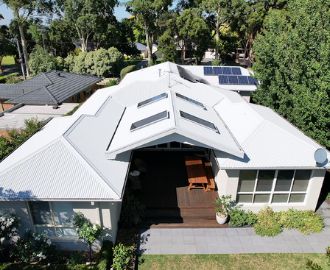 Drone View of a White House Surrounded by Trees